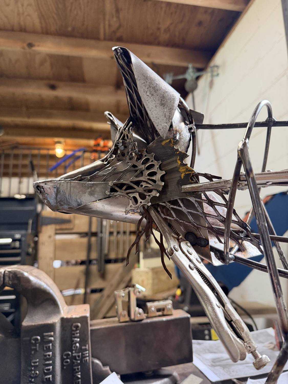 Franklin in progress, close-up of the gear and chain detail forming the face