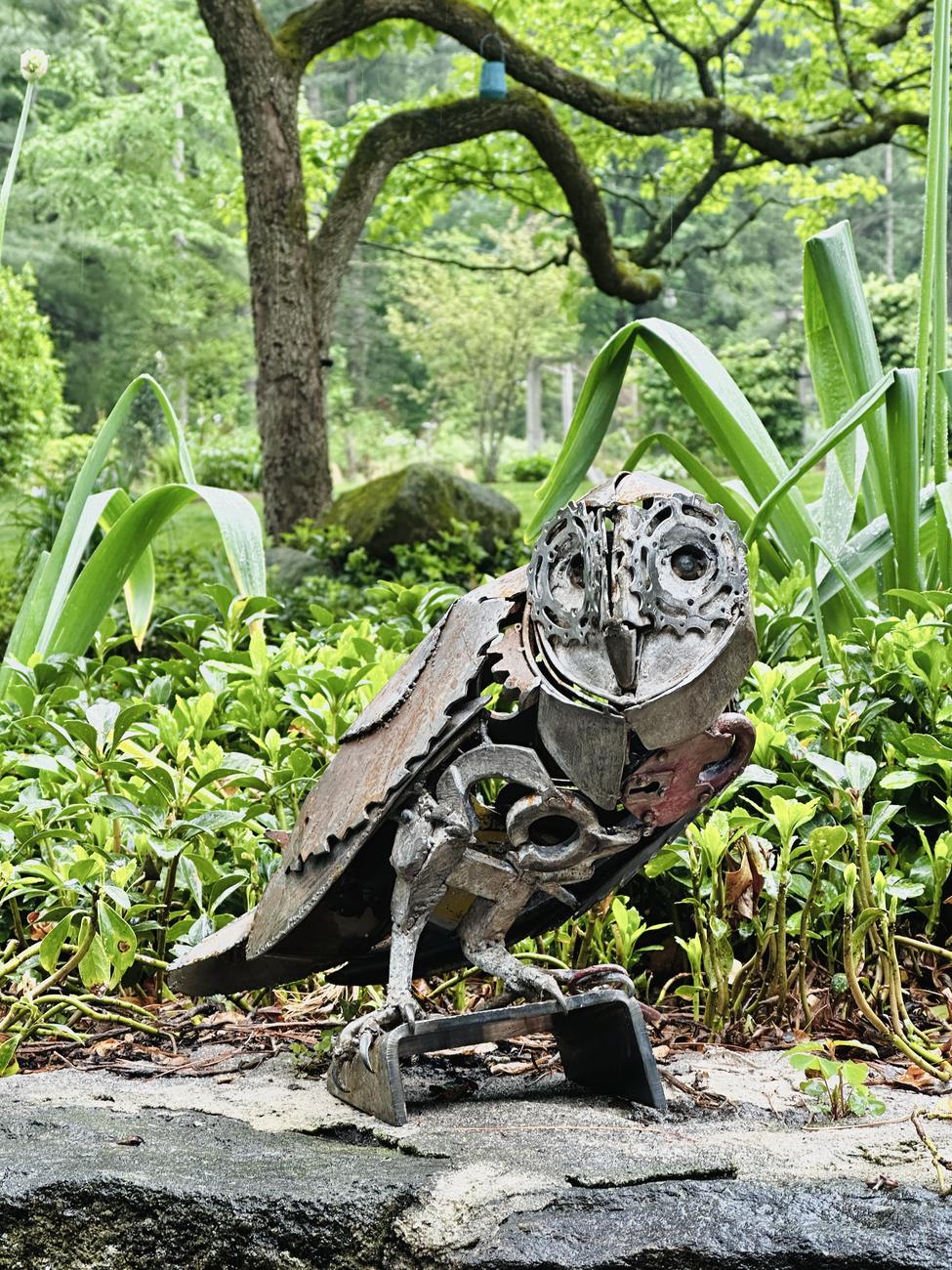 Close-up detail of Locked Away showing gear eyes, an antique lock, and key